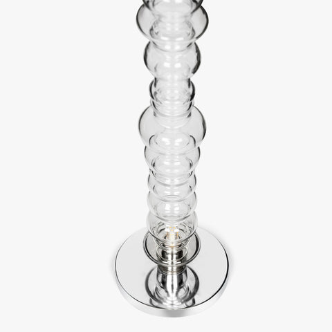 Sculptural clear glass table lamp with stacked glass form and metal base