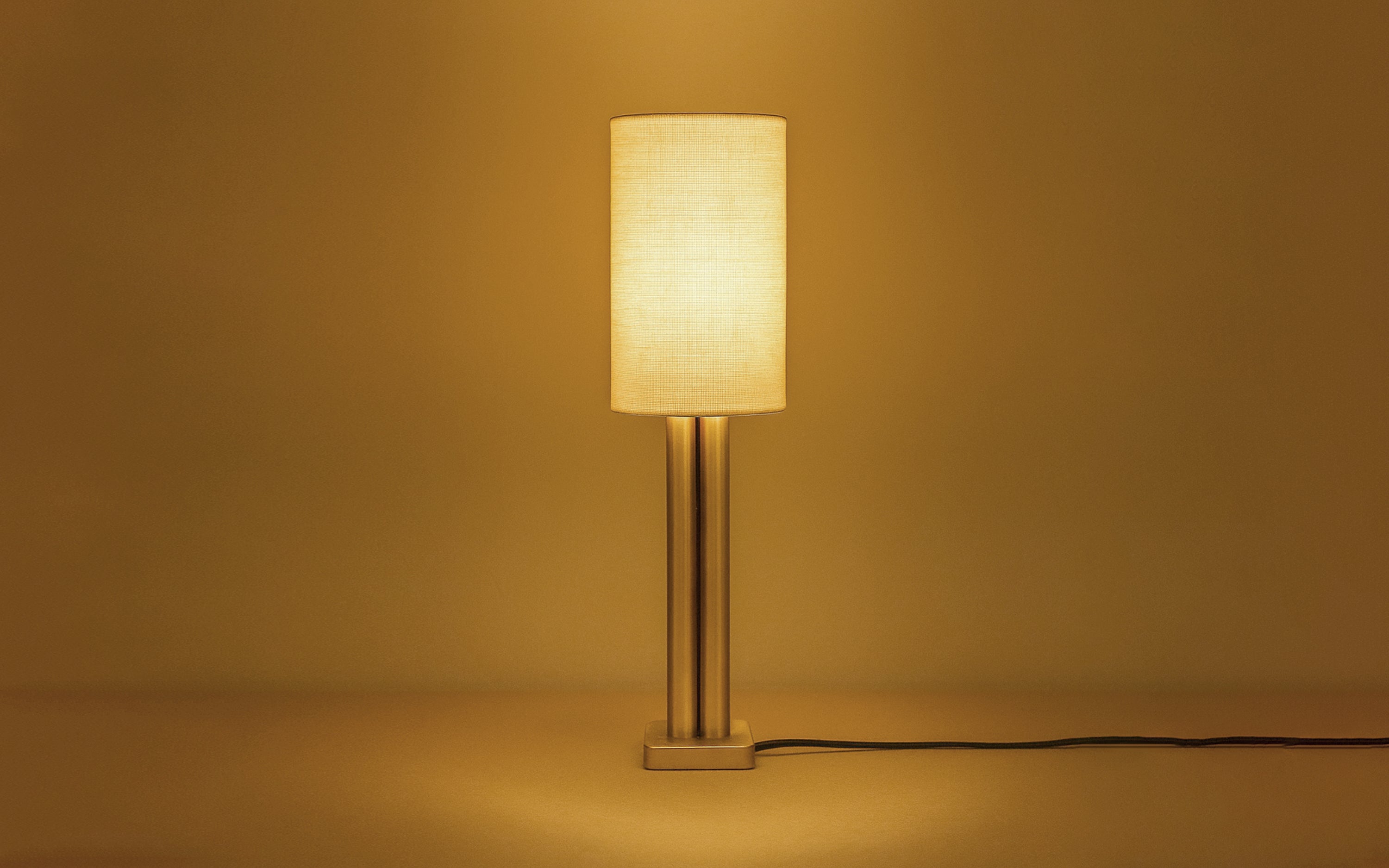 Solis Gold Table Lamp | Gold Finished Base & White Linen Shade - with white background - Orange Tree