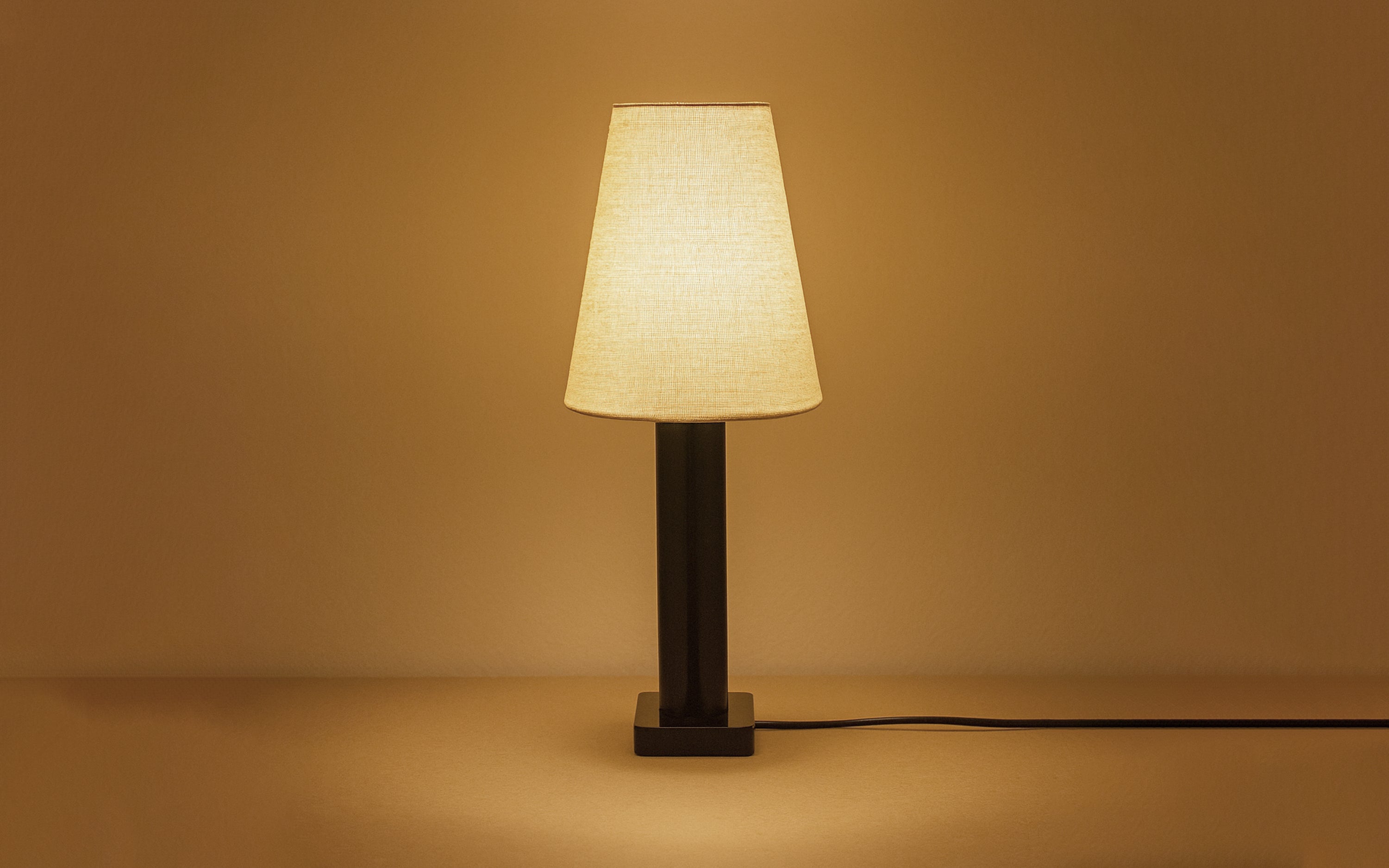 Solis Tall Table Lamp | Black Metal Base & White Linen Shade - with white background - Orange Tree