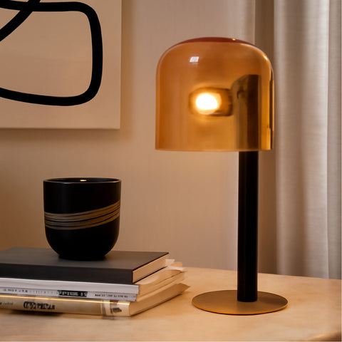 An amber glass study table lamp styled on a desk, perfect as side lamps for living room.