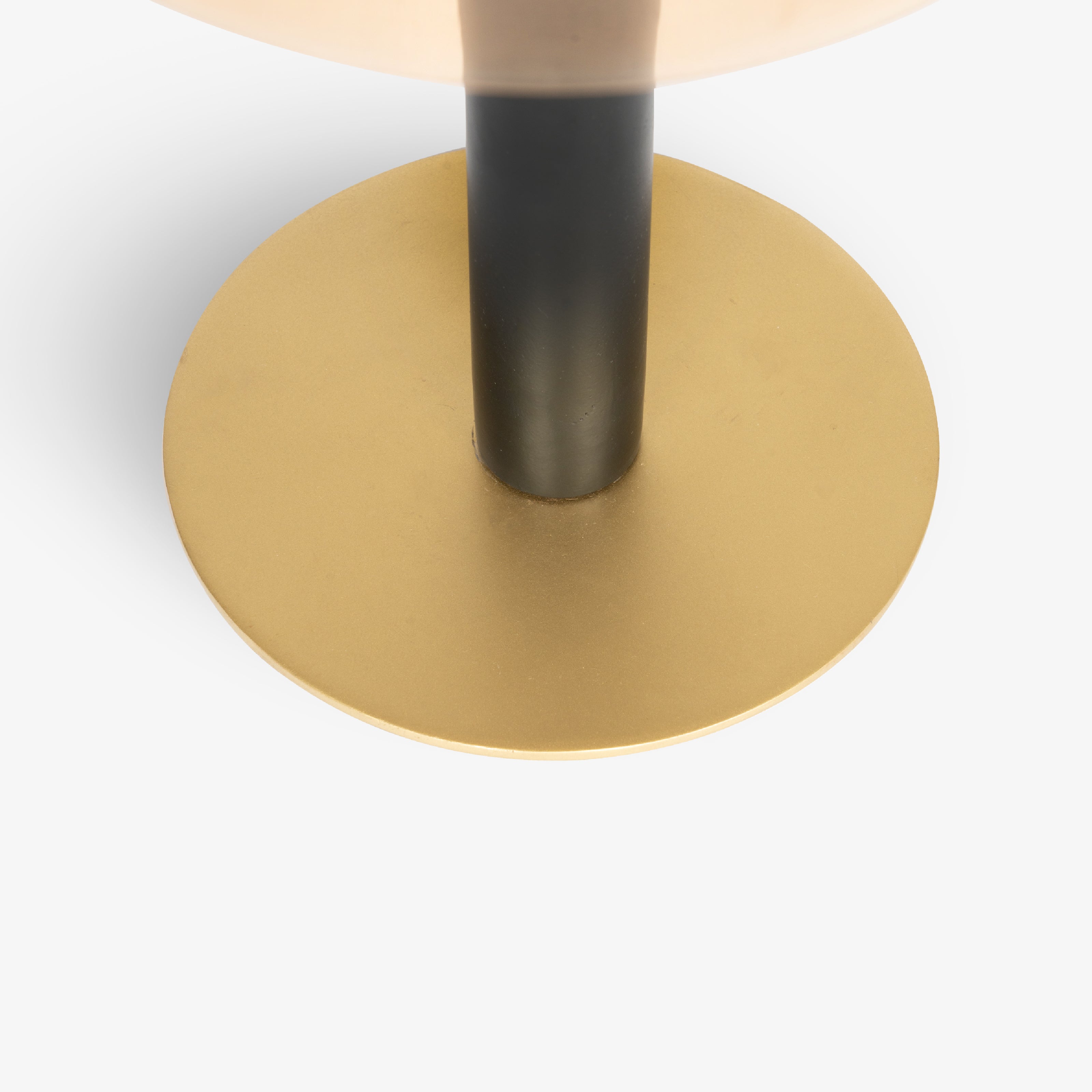 A circular gold-finished base plate designed for high-end home decor lamps.