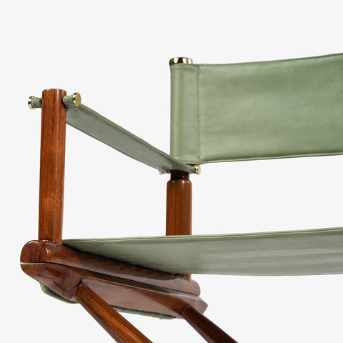 Close-up of chair frame and green canvas