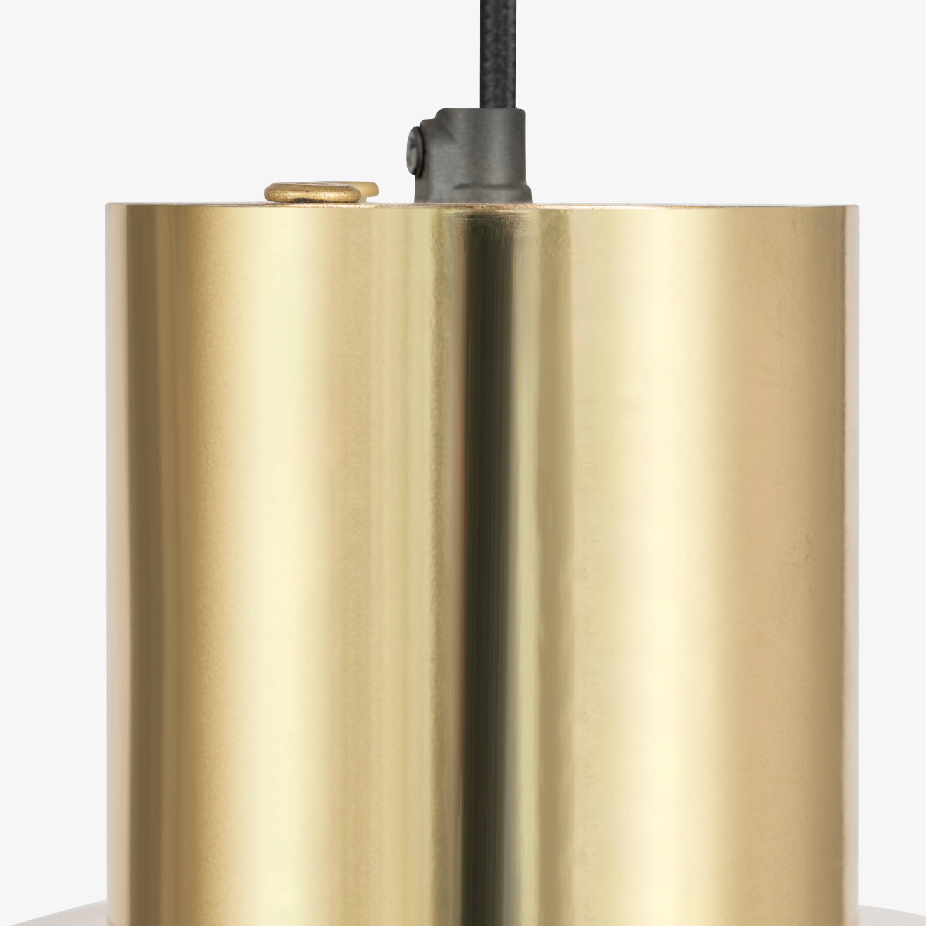 Brass finish metal top detail of modern pendant lighting fixture