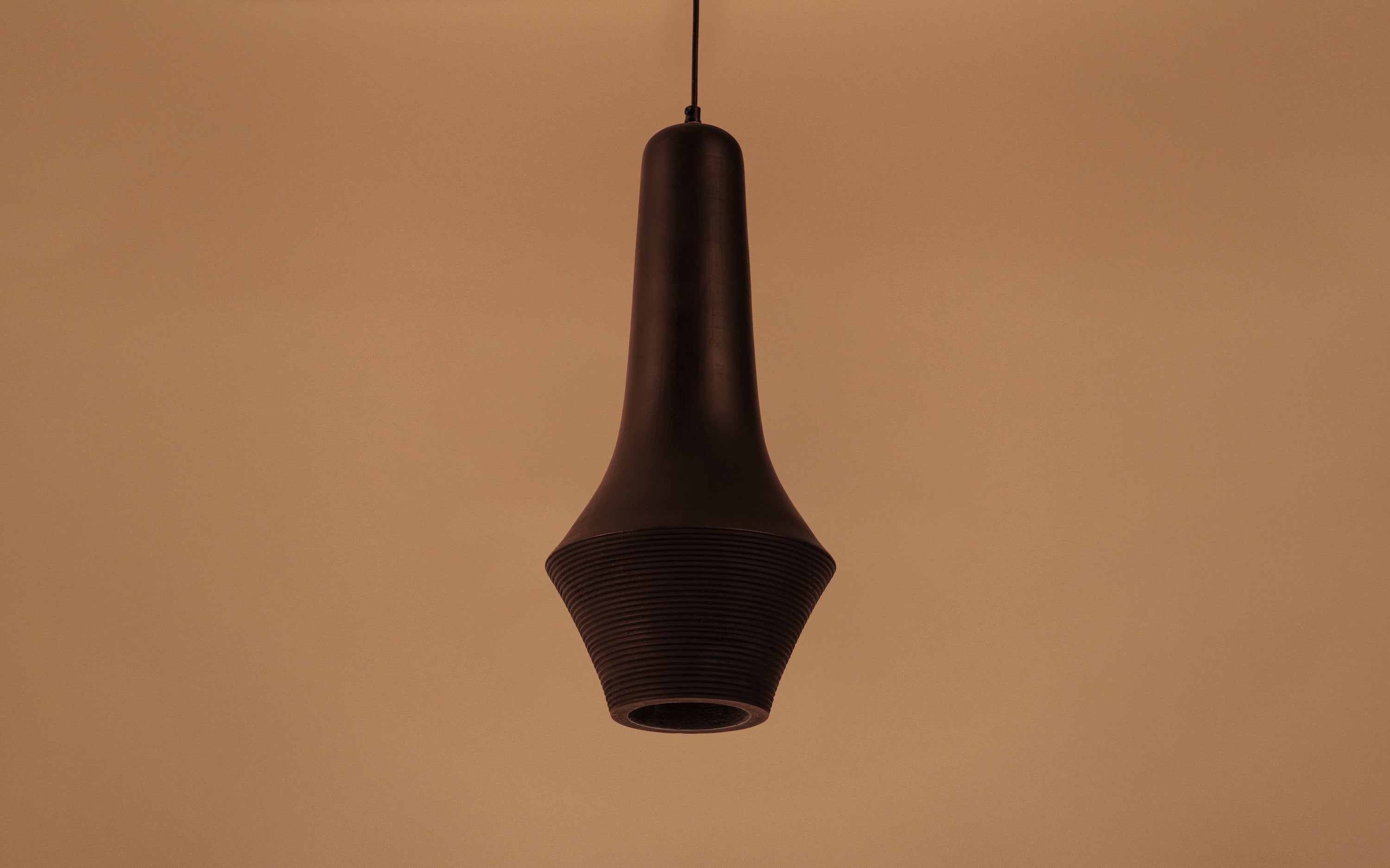 Buy Umbra Slender Black Pendant Hanging Lamp in Mango Wood - Close shot - from left angle - Orange Tree