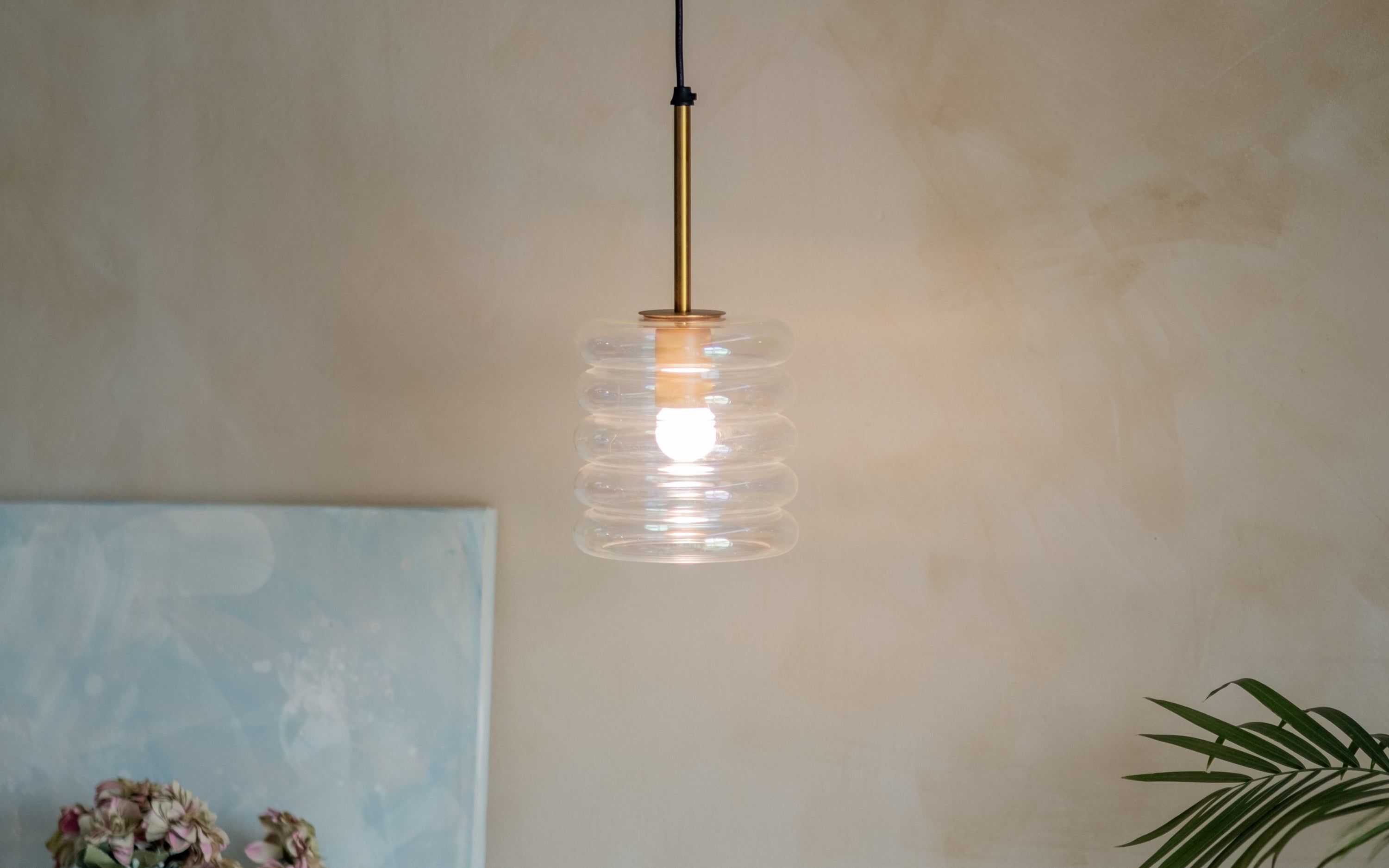 Buy Unio Cylindrical Glass Hanging Lamp | Brass Finished Metal - Close shot - Orange Tree