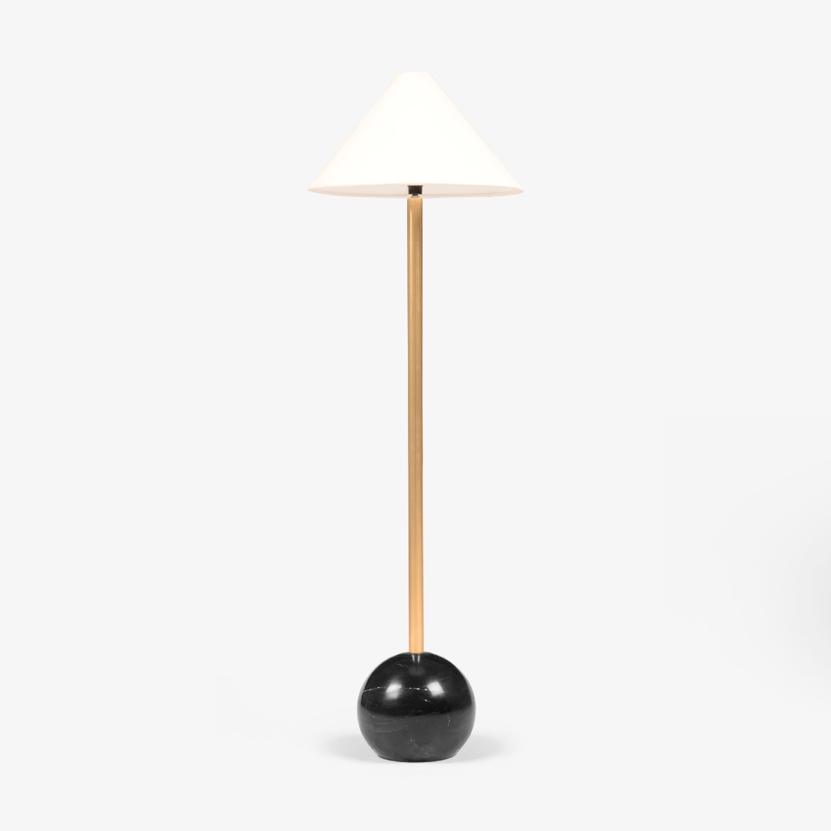 A high-end floor lamp featuring a polished gold stem and a heavy black marble base, ideal for those looking to buy floor lamps online in India.