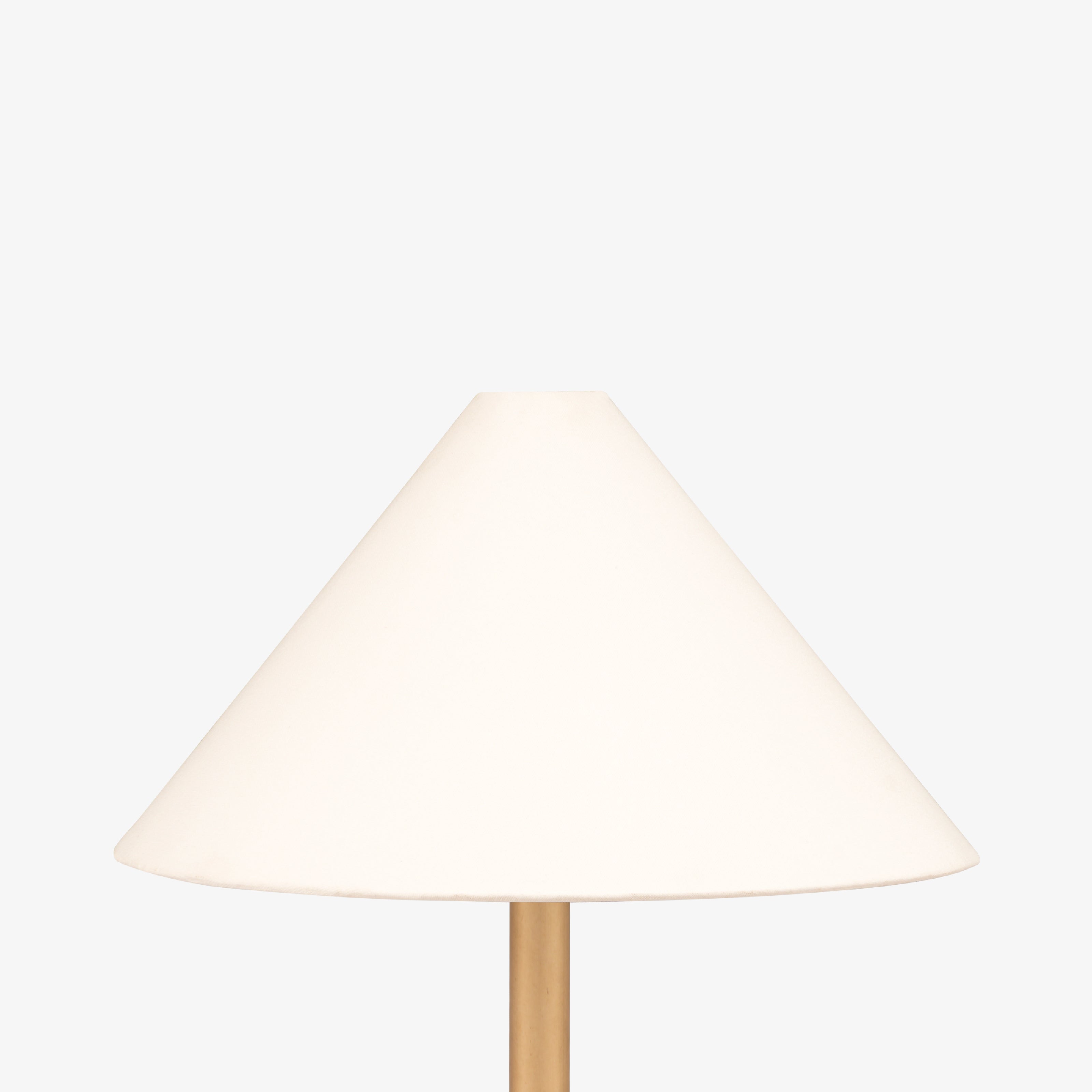 Tall and slender living room long lamps with a contemporary tapered shade and metallic gold finish that complements modern floor lamps India style.