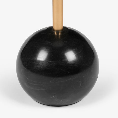 A close-up of the weighted black spherical base and gold stem, highlighting the premium build of these floor lamps for living room.