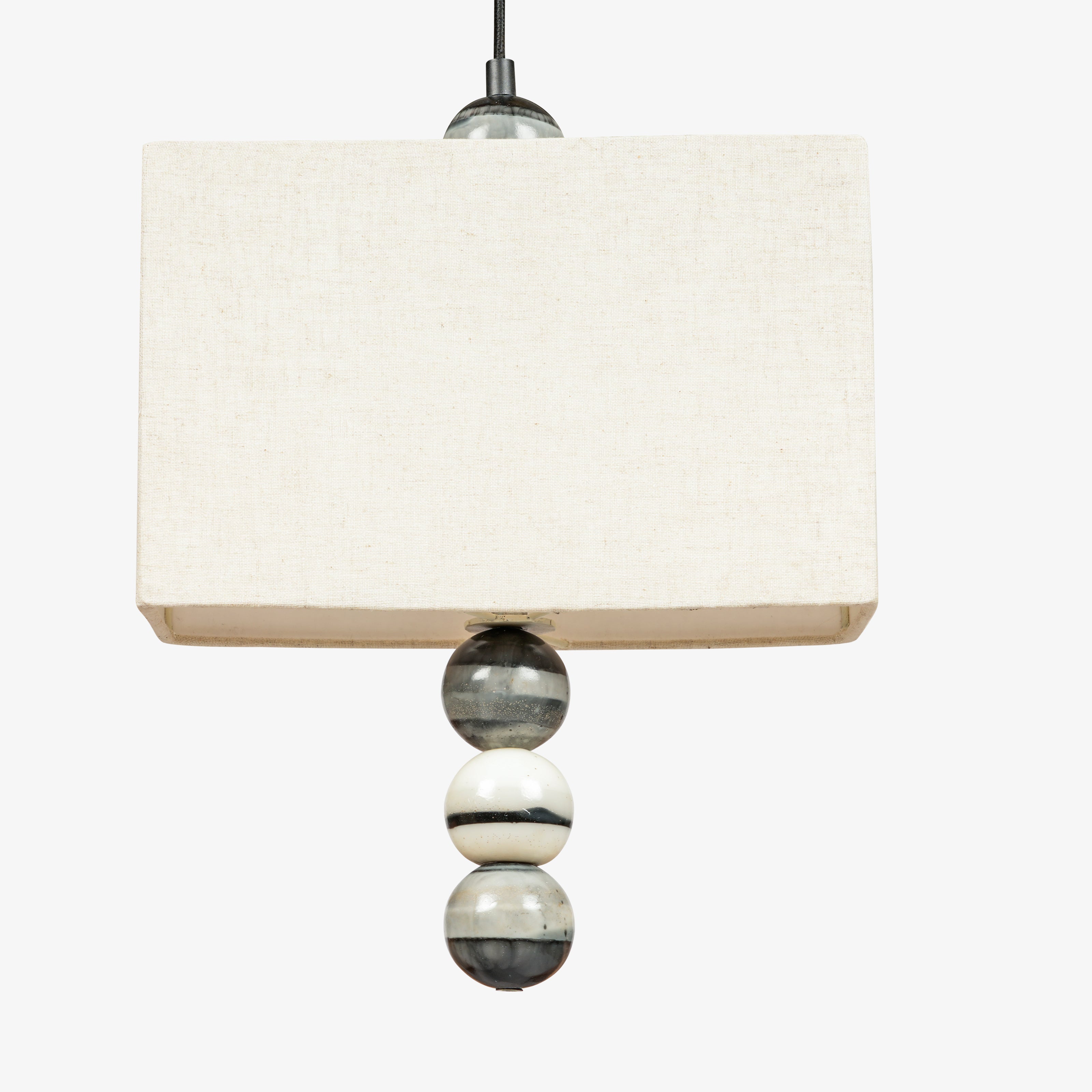 Close-up of linen fabric lampshade on pendant light, premium textured shade for interior lighting.