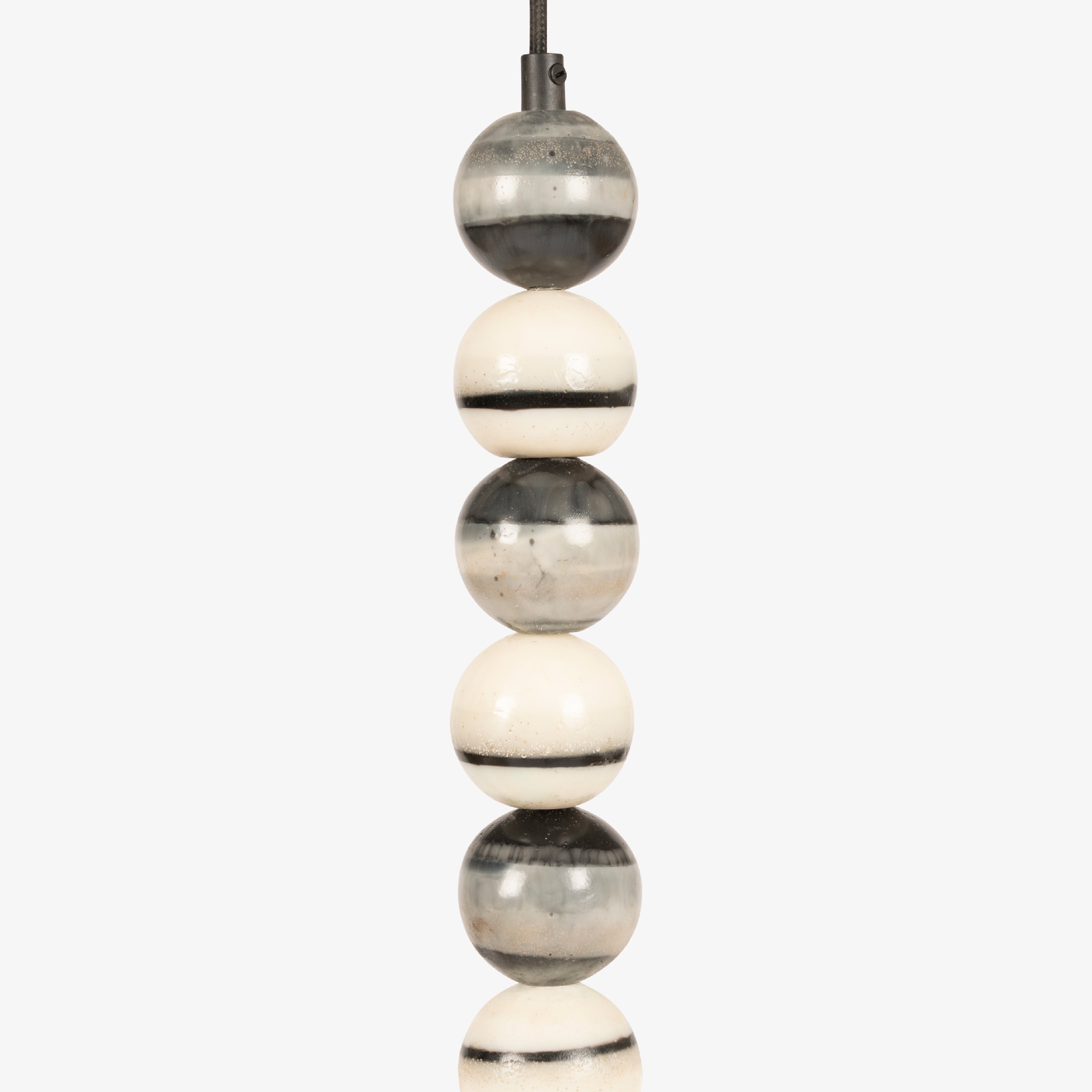 Close-up of the handcrafted ceramic beads in various glazes, highlighting the artisanal quality of these home decor lamps.