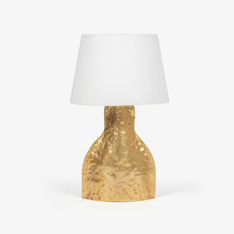 Front-facing bedroom table lamps featuring polished gold pillars and white sphere bulbs.