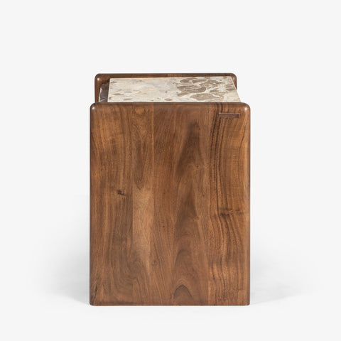 Side view of carved wood bedside table