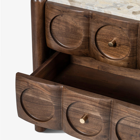 Drawer open on wood bedside table