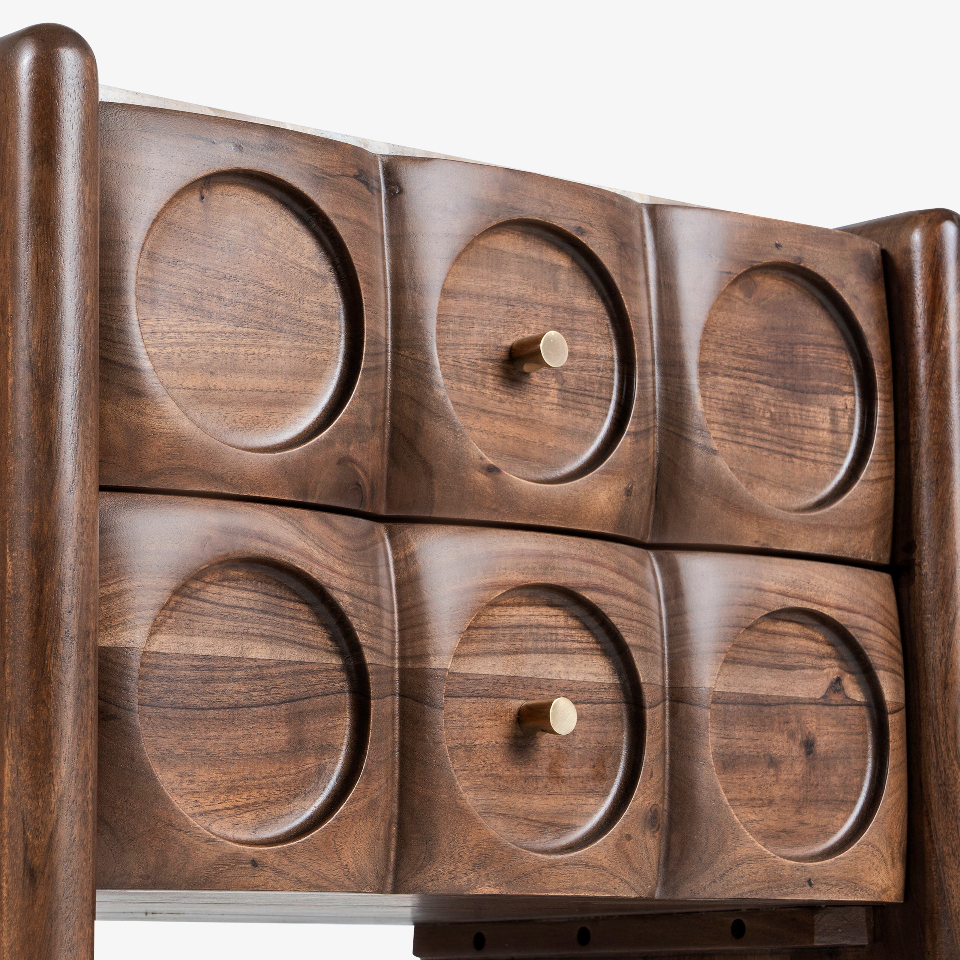 Front view of carved wood bedside table