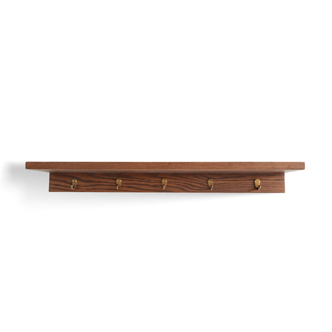 Front view of Kanso Ledge Shelf with raised edge and integrated hooks underneath