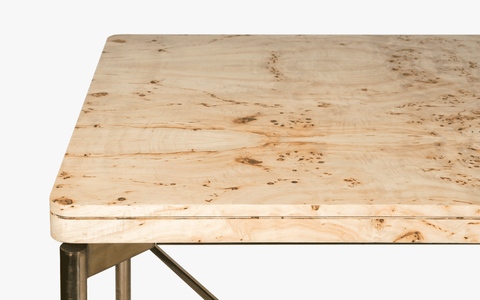 Nouve Wooden Dining Table 6 Seater with curved edges and vintage design, crafted from Burl Veneer and Stainless Steel, with a light-brushed satin brass finish on legs.