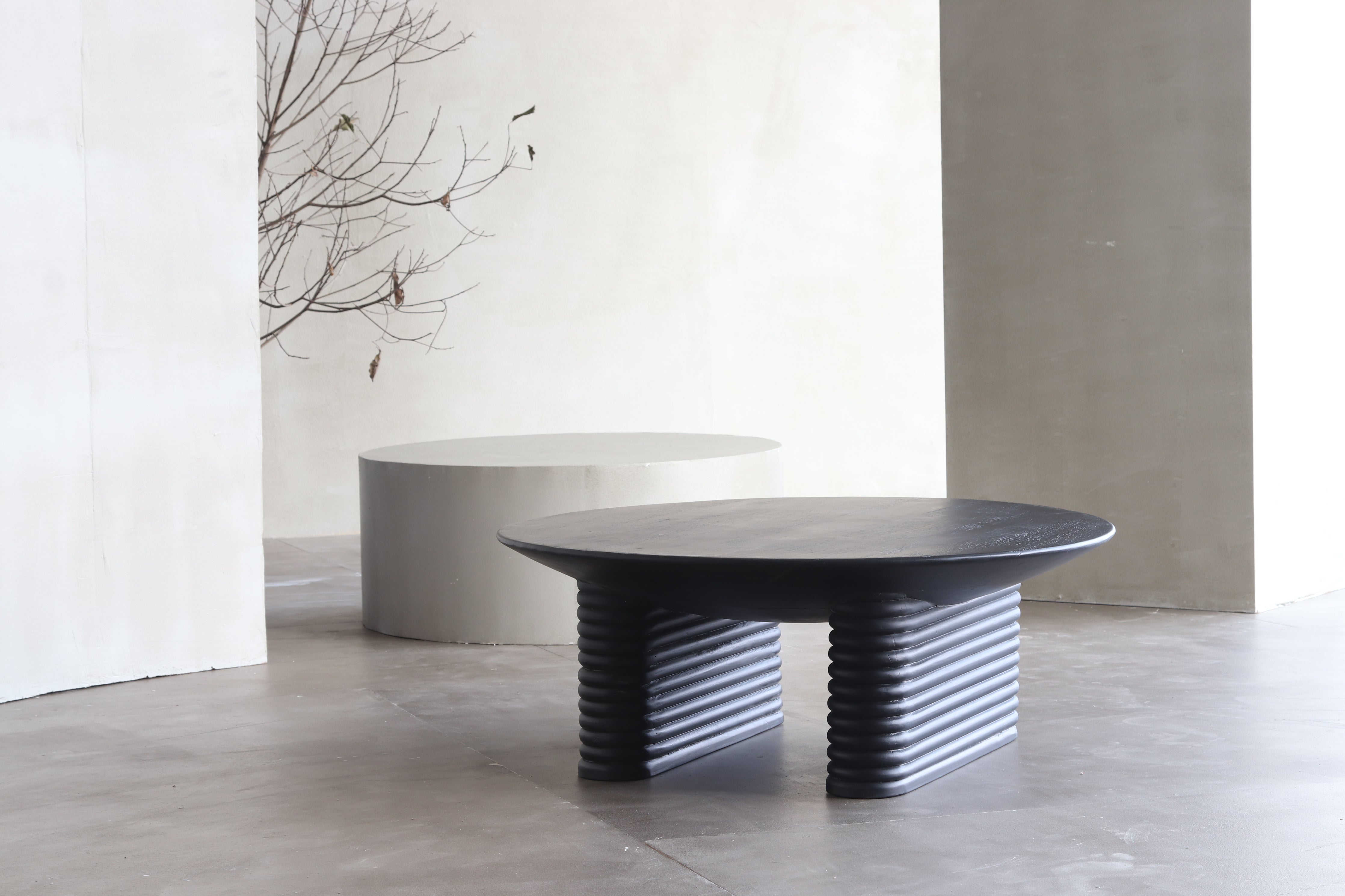 Black Ribbed Round Mango Wood Coffee Table - Close shot - from right angle - Orange Tree