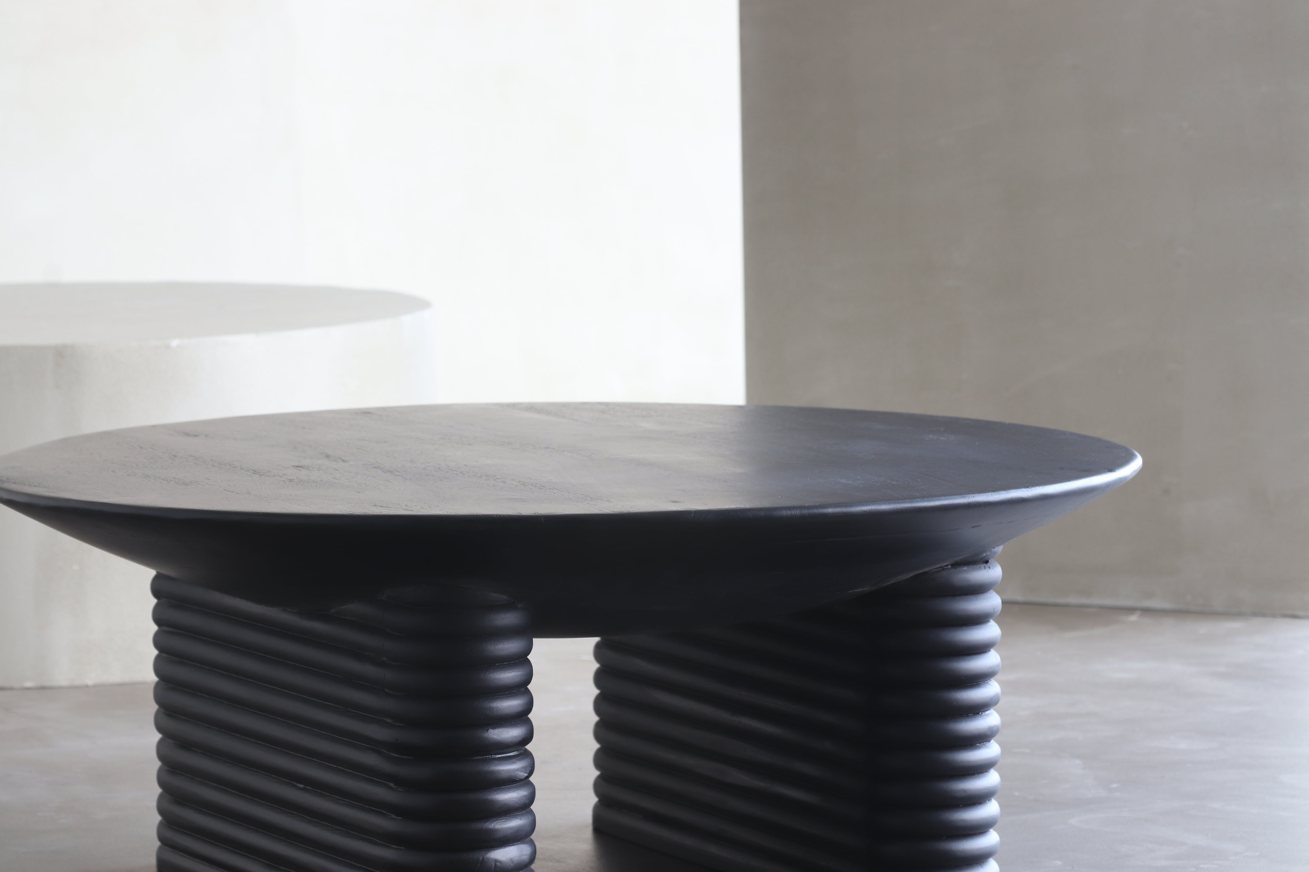 Ribbed Round Wooden Coffee Table in black finish.