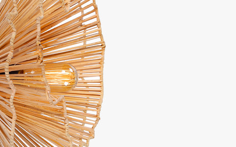 Klimt Cane Wall Lamp with natural cane shade on an abstract mild steel frame. Impressionism-inspired design for a unique decorative wall light