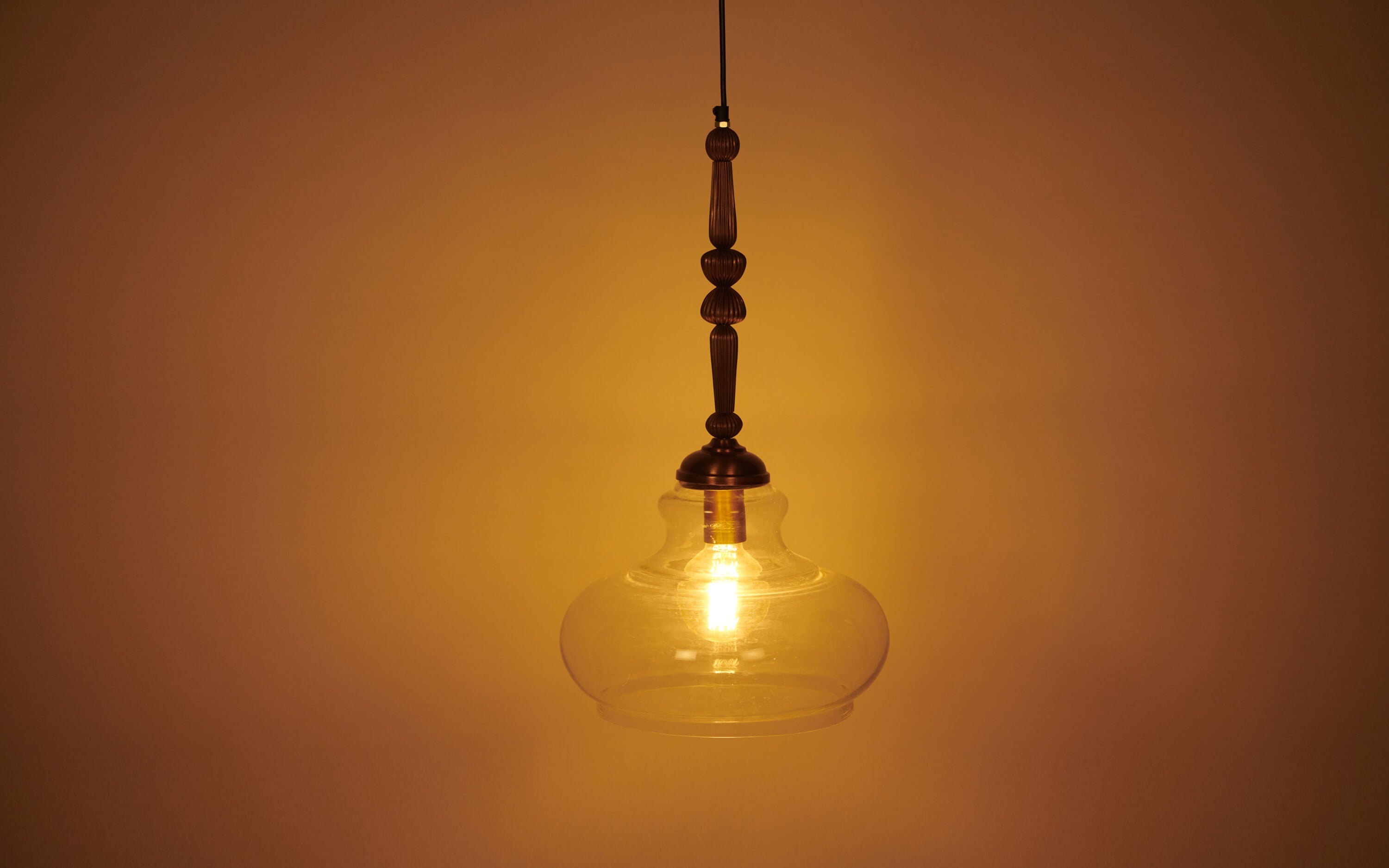 Buy Kurashi Oval Glass Pendant Light for Hallways - Close shot - from left angle - Orange Tree
