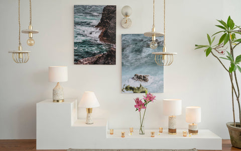 Eros White Wall Lamp with Terrazzo base, Gold-finished Mild Steel, and Frosted Glass shade.  This lamp is available online in India.